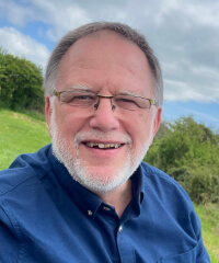 A head and shoulder portrait of Emyr MacDonald