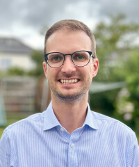 A head and shoulder portrait of Tom Roberts